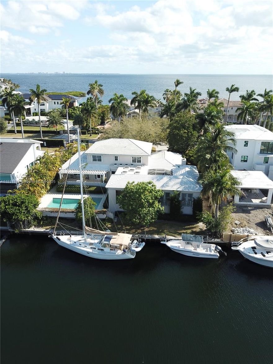 This 6br/5bth property on Mar Street is unique as it sits on a much larger lot than almost all Gables by the Sea homes. With an 18,000+ sf lot, this house is set well back from the street, giving it a stately presence. Inside, the home features a traditional layout with defined living and dining spaces, a spacious well appointed kitchen, and large windows that frame peaceful water views. The main living areas are warm and inviting, ideal for everyday living or entertaining guests. A spacious ground floor master bedroom wing offers an accessible peaceful respite from daily pressures and offers separation and privacy from the rest of the living areas. A screened breezeway leads to the 700 sf apt.  House is 5/4 and apt. is 1/1 incl full kitchen and living room. The home is sold "as is".