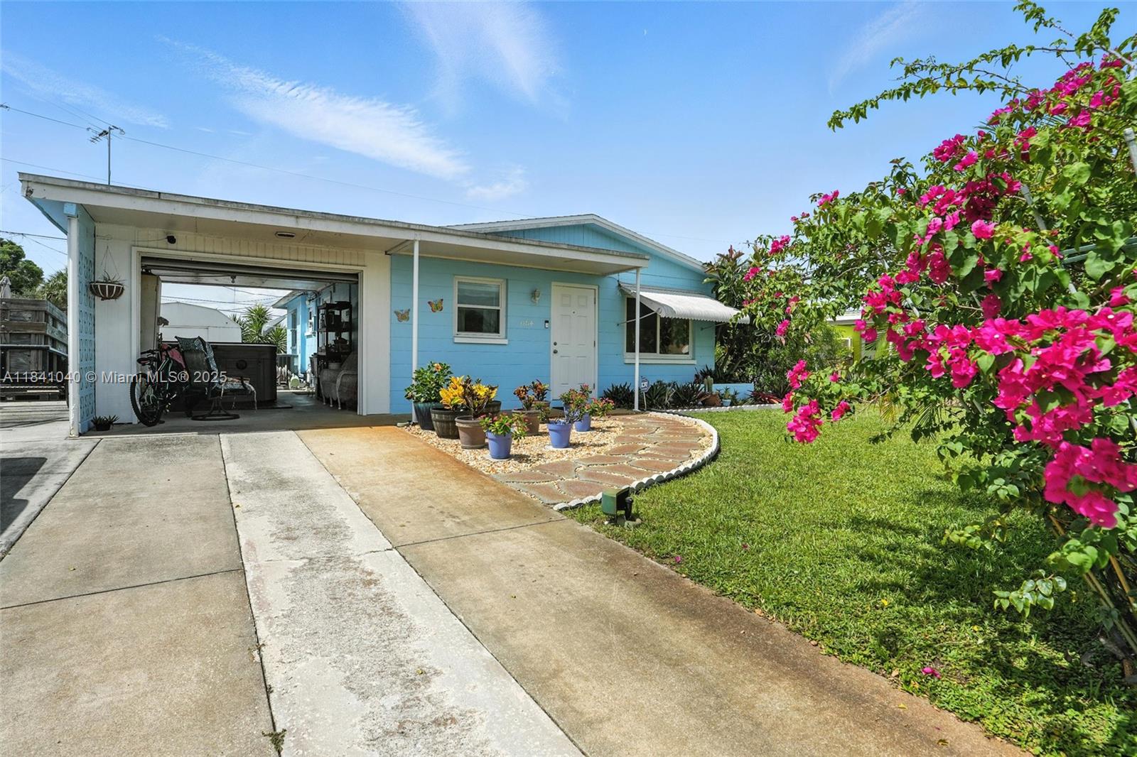 This well-maintained property offers a perfect blend of modern style and peaceful surroundings. Step inside to an open-concept layout that seamlessly connects the living, kitchen, and dining areas—perfect for hosting or simply enjoying quiet evenings at home. The modern kitchen features sleek countertops, BRAND NEW fingerless slate appliances, and ample storage to inspire your inner chef. The primary suite offers a relaxing retreat with a large closet with shelving for storage. Enjoy outdoor living on your newly installed paver patio and make the most of the expansive backyard—ideal for gardening, entertaining, or soaking up the Florida sunshine.Ideally located just minutes from nearby shopping centers, dining, and essential services,.