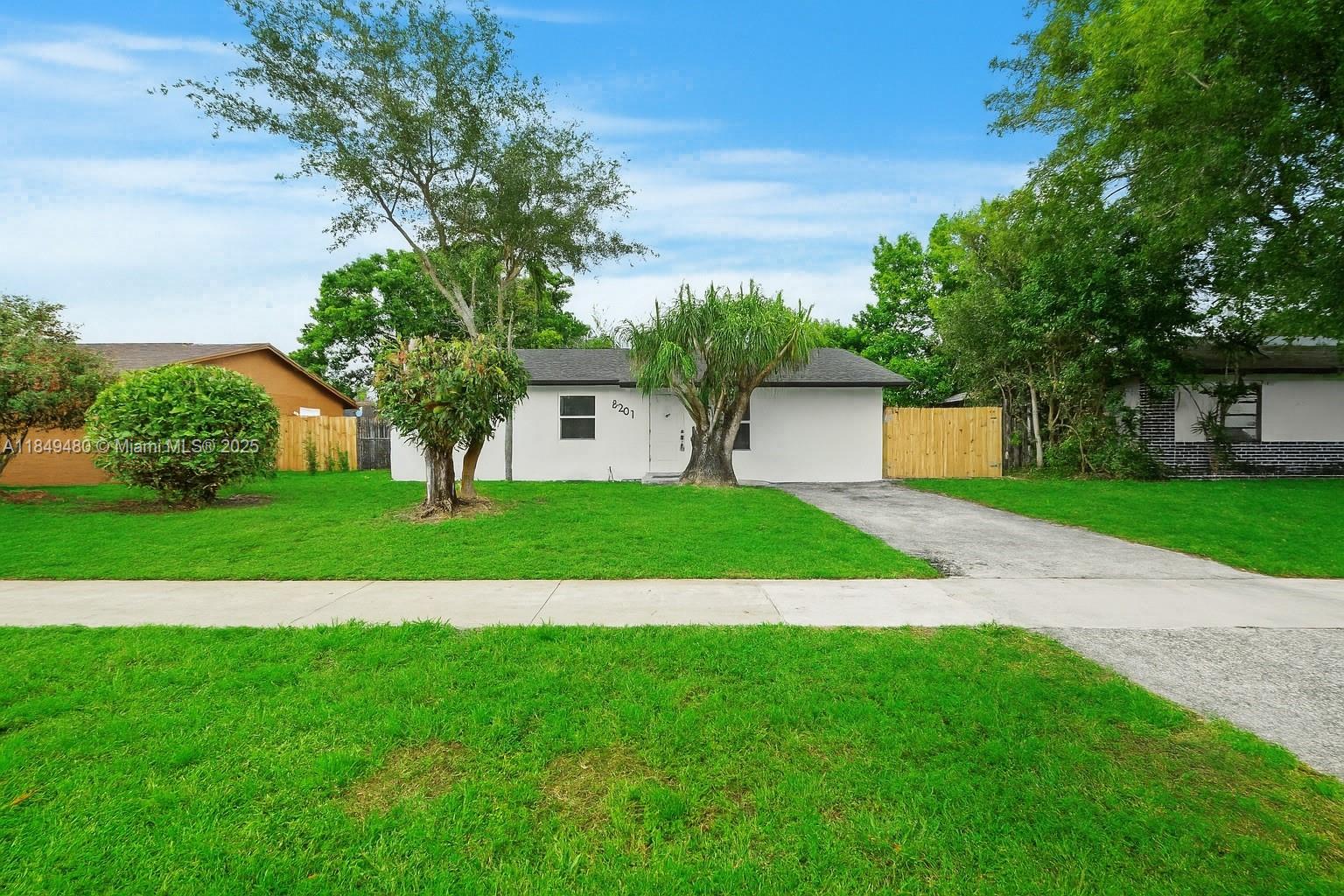 A truly REMARKABLE and COMPLETELY RENOVATED 3-bedroom, 2-bath home where NO STONE WAS LEFT UNTURNED. Every inch of this property has been redone with FULL CITY PERMITS and UP TO CODE, offering peace of mind and modern comfort. Enjoy a BRAND NEW ROOF, and IMPACT WINDOWS,. The sleek NEW KITCHEN features STAINLESS STEEL APPLIANCES, quartz countertops, and custom cabinetry, while the NEW BATHROOMS showcase stylish, modern finishes. NEW WIRING SYSTEM, ALL NEW LIGHTING FIXTURES, ALL NEW DOORS throughout, with beautiful 32x32 PORCELAIN TILE FLOORS, flow seamlessly throughout the space, giving it a modern and elegant touch. Located just minutes from Hampton Pines Park, local schools, shopping, and major highways, this home offers the perfect blend of quality, style, and location—truly TURNKEY.