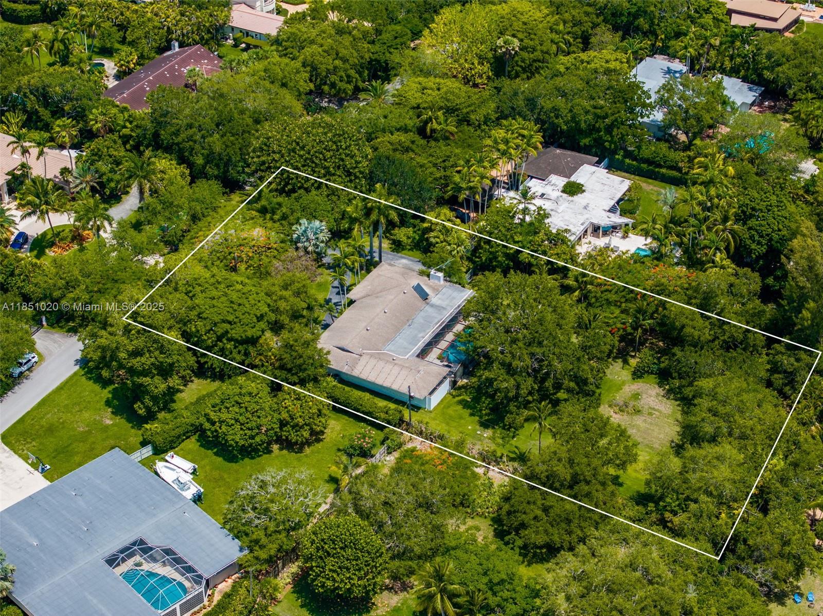 Exceptional Opportunity in Prime Pinecrest! This 41,560.50 SF lot (as per owner survey) offers incredible potential for new construction or a complete renovation. Its rectangular shape provides the perfect canvas for developers aiming to build a dream home or an exclusive residential estate. It's located in a quit street surrounded by trees. On this prime lot, you will find a spacious 2,747 SF home, featuring 4 large bedrooms, 2.5 bathrooms, 2-car garage. The back of the house opens to a solar-heated, screened-in pool & a beautiful entertainment area overlooking a deep, fenced lot surrounded by oak and palm trees. Situated within the desirable Pinecrest Elementary School district, this home qualifies for maximum insurance mitigation credits and is located in an X flood zone. A must see!
