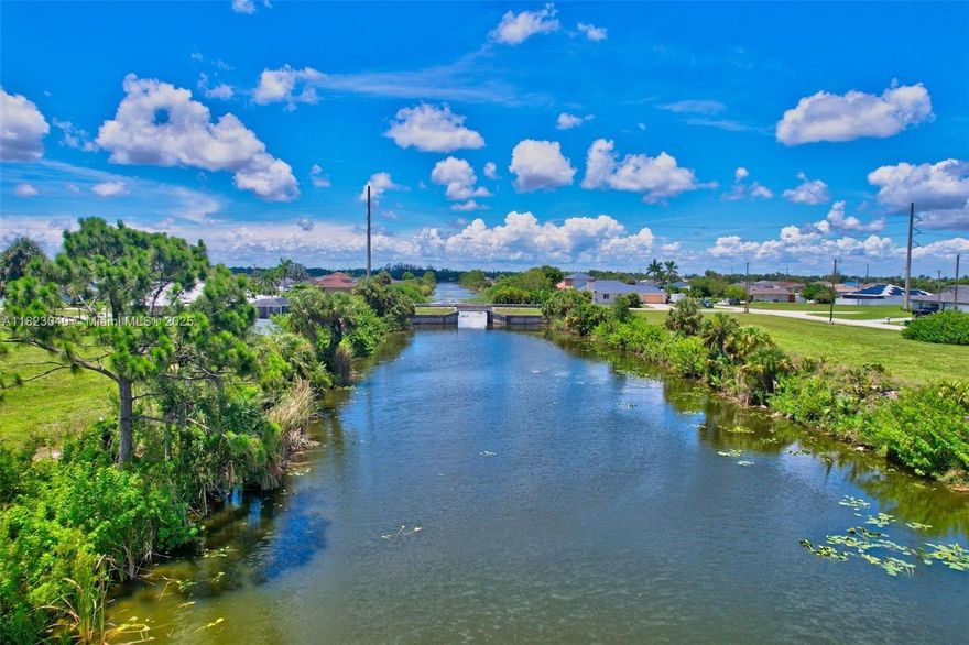 This beautiful vacant lot in Cape Coral offers a prime location near the Gator Slough Canal, ideal for building your
dream waterfront home. Enjoy the quintessential Florida lifestyle with easy access to boating, fishing, golf, tennis,
and numerous other recreational activities. The property provides convenient access to major highways like US 41
and I-75, and it's close to Fort Myers, Lehigh Acres, and Southwest Florida International Airport. From US 41, Take
Kismet Parkway West and Turn North on NE 5th Pl. The Lot is on the East Side.