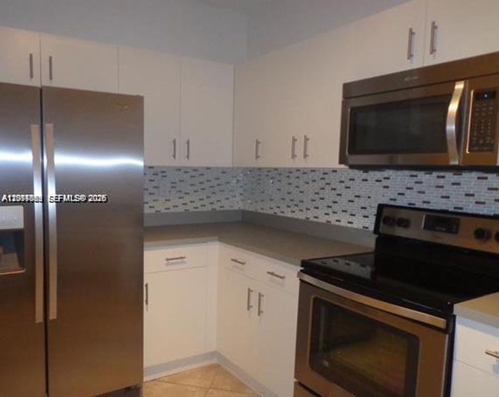 Photo of 2218 NW 160th Ter #2218, Pembroke Pines, FL 33028 (MLS # A12017089)