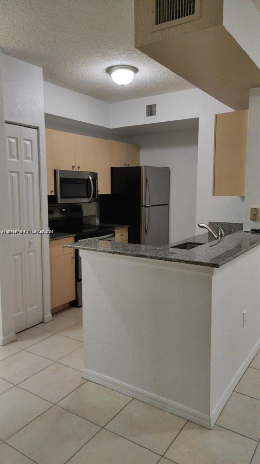 Photo of 2430 Centergate Dr #106, Miramar, FL 33025 (MLS # A11999095)