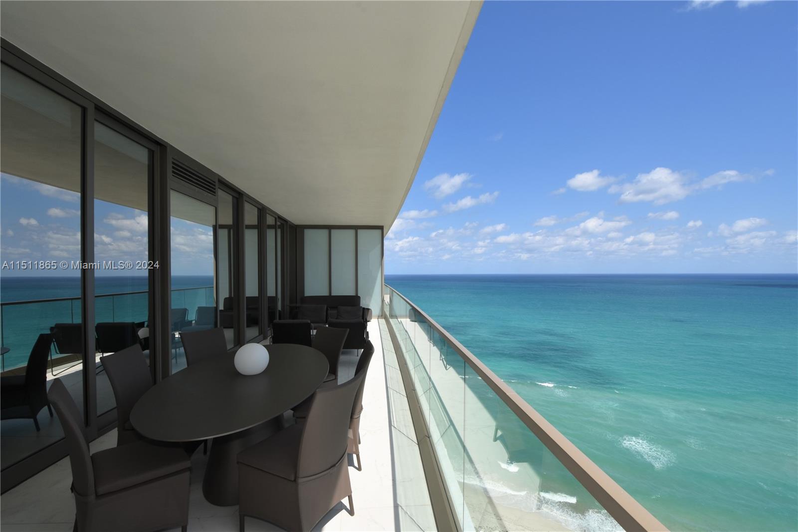 Discover luxury living at Armani Casa, where Cesar Pelli and Giorgio Armani's impeccable design meets functionality. This immaculate residence offers a flow-through floor plan, three bedrooms, a den, five and a half bathrooms. Enjoy abundant natural light and stunning ocean, city, and bay views through floor-to-ceiling windows. Every detail is exquisite, from custom closets to marble bathrooms. The expansive balcony features a summer kitchen for outdoor entertaining. Exclusive resort-style amenities include pool and beach service, a spa, fitness center, restaurant, bar, cigar and wine lounge, private movie theater, and more.