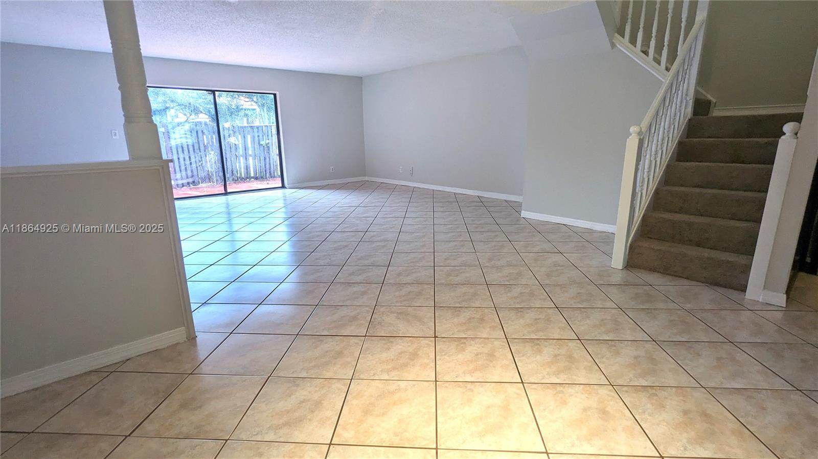 3 bed/2.5 bath townhouse is located in the community of Chateaulaine. This is one of the few 3 bedroom homes in this community. Freshly painted with brand-new carpet in the bedrooms & stairs; tile in the main living areas. The first floor features an open concept layout perfect for entertaining. Kitchen has brand new refrigerator & dishwasher. The guest bath & laundry are downstairs, along with access to a private fenced patio, ideal for relaxing outdoors. All bedrooms are located on the second floor. The primary suite includes an ensuite bath with separate tub & shower with marble tile. Just steps from the community pool, this home combines comfort, location, and lifestyle in one. Zoned for Central Park Elementary, which is a highly desired A+ school.