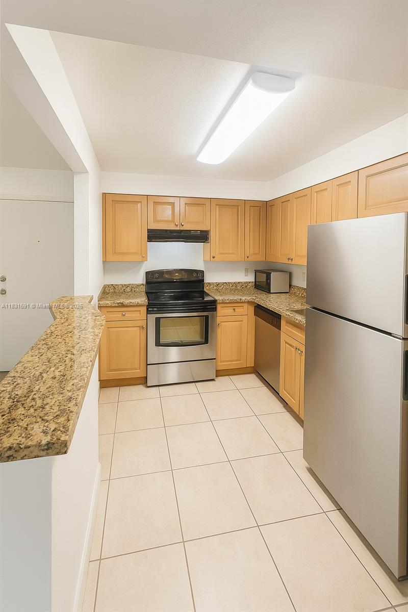 Spacious 1 bed / 1 bath condo in a prime location near Downtown Doral, Doral Central Park, CityPlace, and Top Golf. First-floor garden unit with large private patio (~100 sqft), ideal for relaxing or entertaining. Updated kitchen with stainless steel appliances, ceramic floors, walk-in closet, and impact windows. Assigned parking + guest spaces. Gated community with pool, gym, clubhouse, tennis, and laundry. Excellent transit: Freebee, local buses, and easy highway access. Water & HOA included. Small Pets welcome.