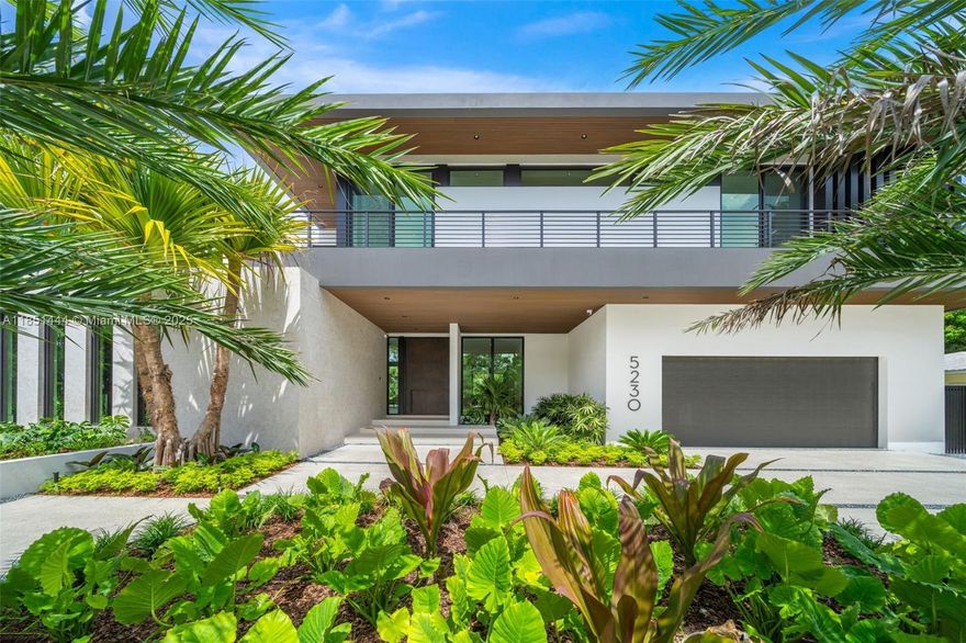 A newly completed tropical modern masterpiece in prestigious High Pines, designed by Preschel Bassan with lush landscaping by Exoticscape. Showcasing a dramatic double-height great room, sculptural staircase, and floor-to-ceiling impact windows that flood the home with light. Features include a gourmet MiaCucina kitchen with hidden butler’s pantry, resort-style pool with jacuzzi, expansive terraces, cabana bath, smart-home wiring, generator ready, and elevator shaft. The primary suite offers private terrace views, spa bath, and dual walk-ins. Additional highlights include a flexible office space, second-floor wet bar with walk-through linen closets, and curated architectural finishes. Seamlessly blending form, function, and tropical luxury, this home defines refined Miami living.