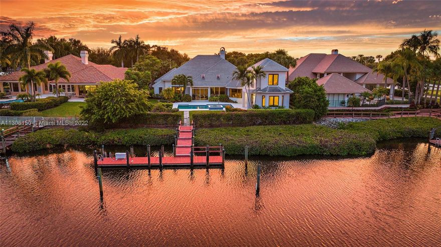 Waterfront Estate Home - This property is conveniently located close to the entrance and The Club with dockage that is within minutes to the Intracoastal. 4 large guest suites with private bath, oversized closets plus den/office Murphy bed, lavish primary suite with sitting room, 2 separate full baths and closets, fabulous views of interior waterway, open kitchen to family room and breakfast area, living room with coral fireplace, tons of rear yard with pool and patio. Make this home your own!