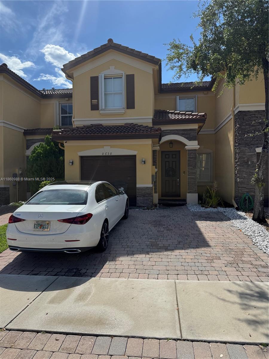 Beautifull Townhome in the Santorini community. Featuring 3 bedrooms & 2.5 bathrooms with 1,650sqft under AC, 1 car garage and two parking space at the driveway, spectacular lake view conveniently located and guest parking. Having your own private backyard with lake view, washer and dryer included. Located right next to Rolando Espinoza Elementary School and the Islands at Doral Clubhouse. Includes amenities like tennis courts, pool, jacuzzi, Gym, basketball courts and more.