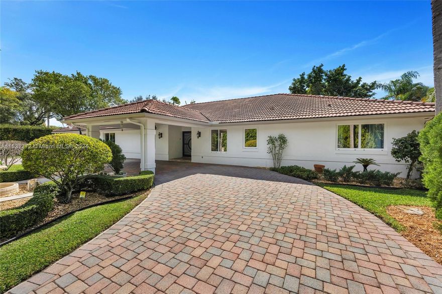 Impressive, South Miami estate home w/high volume ceilings and spacious social areas. You will delight in the space, privacy and luxury you desire. Open chef’s kitchen w/side by side SubZero refrigerator/freezer, JenAir wall ovens and dishwasher, and a new Bosch induction stove top. Two grand primary suites anchor each side of this split floor plan. All BRs have ensuite baths. Porte Cochere, electronic security gate, circular drive, 2 car garage (with enclosed storage space), waterfall pool with large terrace areas, mature landscaping and privacy hedges, shaded play area, private courtyard, tranquil butterfly garden. Custom impact glass entry door, open foyer, combined kitchen/dining area with adjacent sitting area, family room w/direct access to pool. Plus laundry and office/play room.