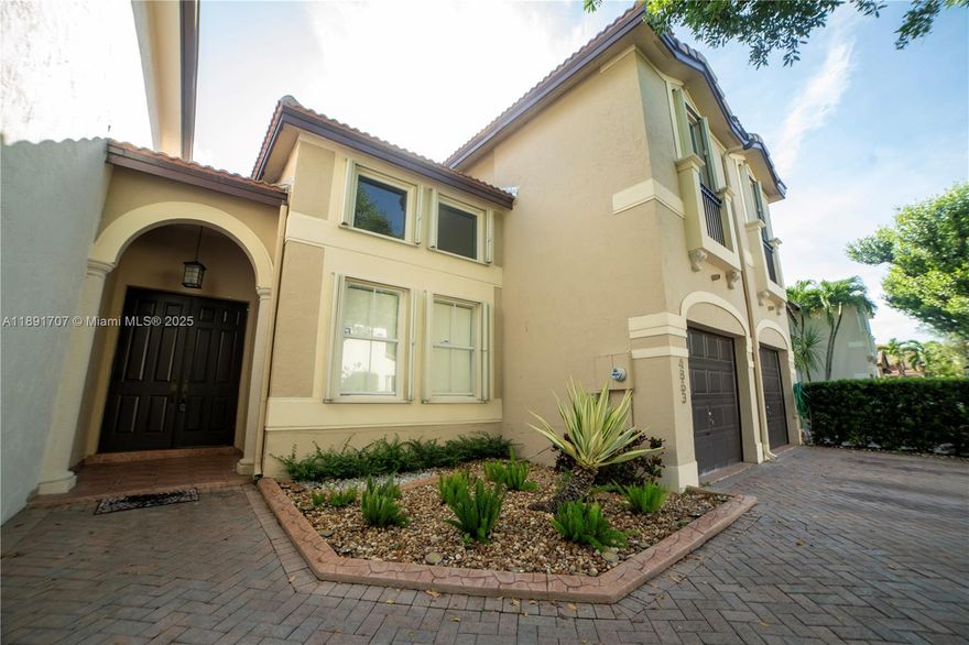Welcome home! This spacious 4BR/3BA residence sits in a quiet, beautifully maintained community. Features 3 bedrooms upstairs plus a versatile studio/den with full bath downstairs—ideal for guests or a home office. Bright living, dining & family rooms create a wonderful flow for everyday living. Kitchen offers granite counters, SS appliances & a NEW refrigerator. Enjoy peace of mind with a NEW roof, NEW A/C & accordion shutters. Relax or entertain on the large tiled patio with a lush hedge for privacy. Centrally located near shops, dining & major highways. LOW HOA & easy to show!