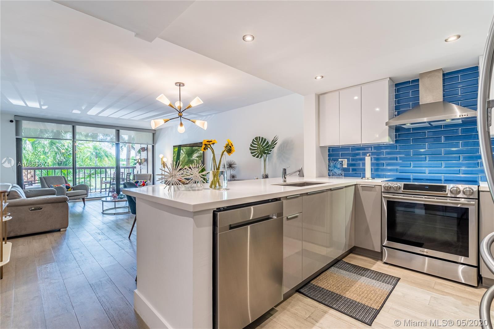 Enjoy the Miami lifestyle in this fabulous 2 bedroom/2 bath home. Built in 1984 with a clean and open floorplan. This unit is completely remodeled and no detail was sprared. Custom made kitchen cabinets, Quartz countertops, Spanish tile back splash, LED Recessed lighting, high end stainless steel appliances, hard wood floors throughout, impact windows and many other amazing features. This home is a MUST see and is move in ready. Will sell fast!