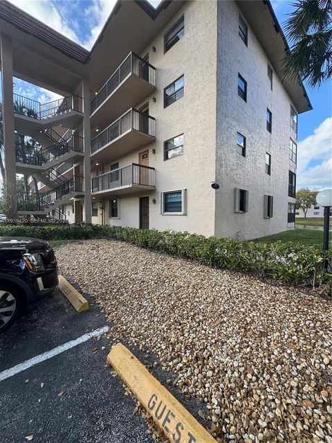 Photo of 4970 E Sabal Palm Blvd #115, Tamarac, FL 33319 (MLS # A11939420)