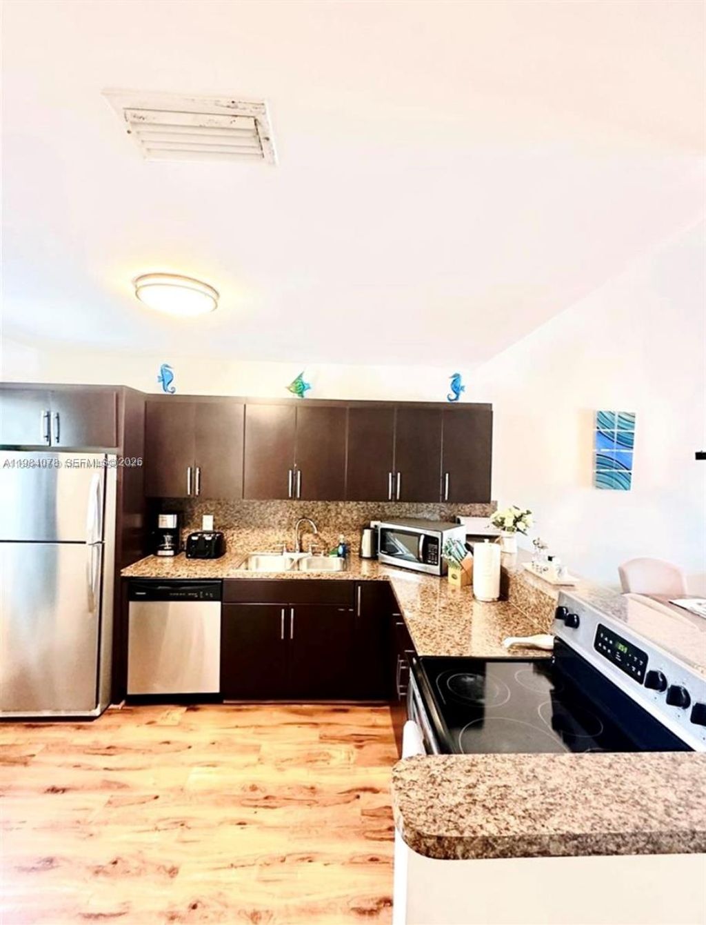 Photo of 2431 SW 58th Mnr #1-2, Dania Beach, FL 33312 (MLS # A11984078)