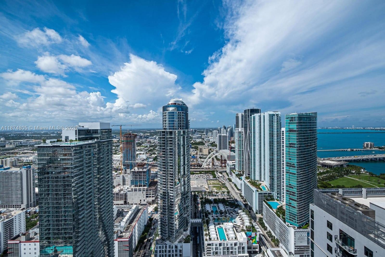 Experience luxury living in the heart of Downtown Miami at Natiivo Miami. This stunning high-rise residence offers breathtaking views of Biscayne Bay, the ocean, and the city skyline from the 51st floor. Featuring modern finishes, porcelain flooring, floor-to-ceiling impact windows, a spacious open layout, and being offered fully furnished, this home is designed for comfort and style.
Enjoy resort-style amenities including a rooftop pool deck, state-of-the-art fitness center, spa, co-working spaces, and multiple lounges. Natiivo Miami is one of the few condominiums fully approved for short-term rentals, giving owners the flexibility to generate income with daily leasing options.