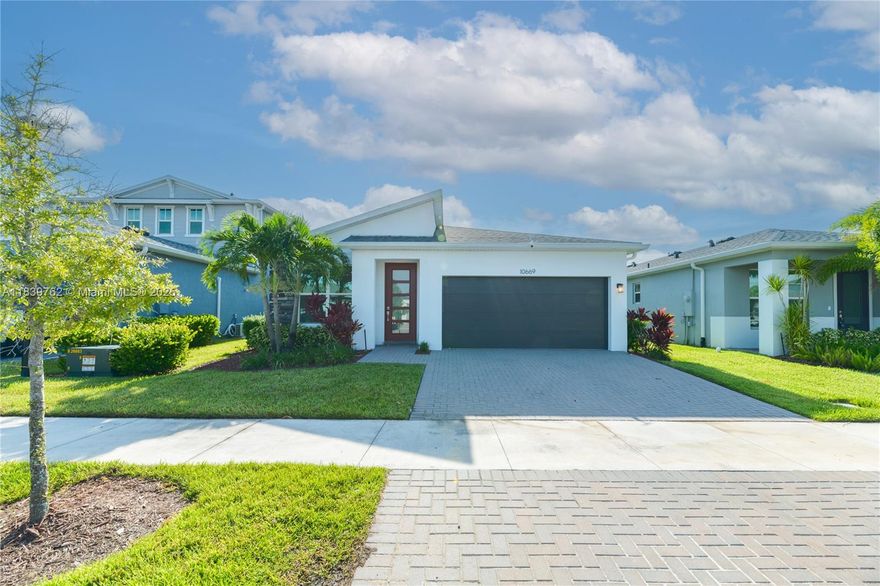 Welcome to this stunning 3BR/2.5BA Briar model in the gated Emery II at Tradition! Built in 2022, this nearly 2,000 sq ft home features impact windows, smart shades, LED lighting, and an open-concept layout perfect for entertaining. The gourmet kitchen boasts quartz countertops and stainless steel appliances, while the spacious primary suite offers a spa-like bath. Enjoy a fenced backyard, 2-car garage, and access to resort-style amenities including pool, fitness center, and trails. Close to Tradition Square, Cleveland Clinic, and top schools—this is luxury living at its best!