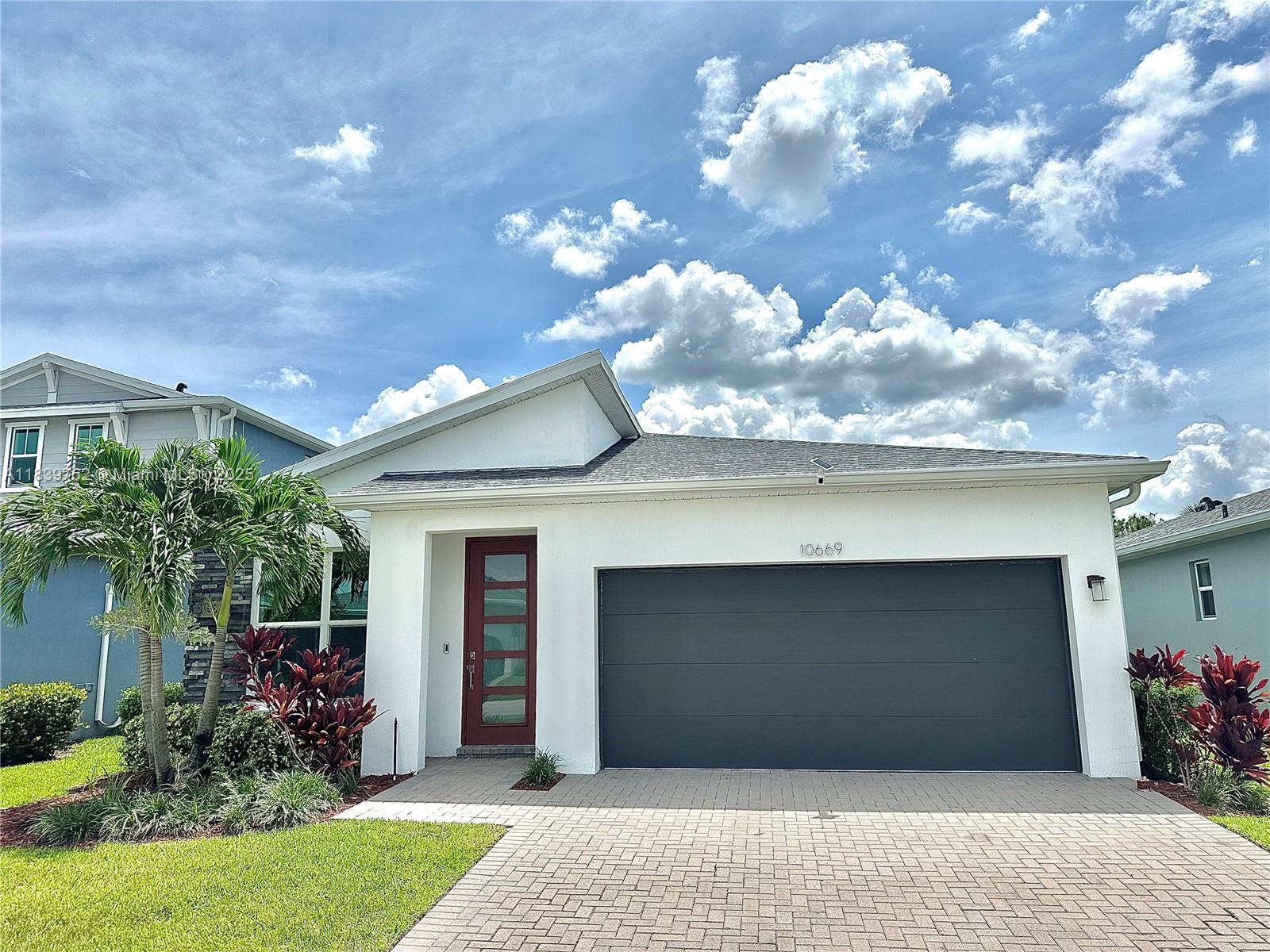 Welcome to this stunning 3BR/2.5BA Briar model in the gated Emery II at Tradition! Built in 2022, this nearly 2,000 sq ft home features impact windows, smart shades, LED lighting, and an open-concept layout perfect for entertaining. The gourmet kitchen boasts quartz countertops and stainless steel appliances, while the spacious primary suite offers a spa-like bath. Enjoy a fenced backyard, 2-car garage, and access to resort-style amenities including pool, fitness center, and trails. Close to Tradition Square, Cleveland Clinic, and top schools—this is luxury living at its best!