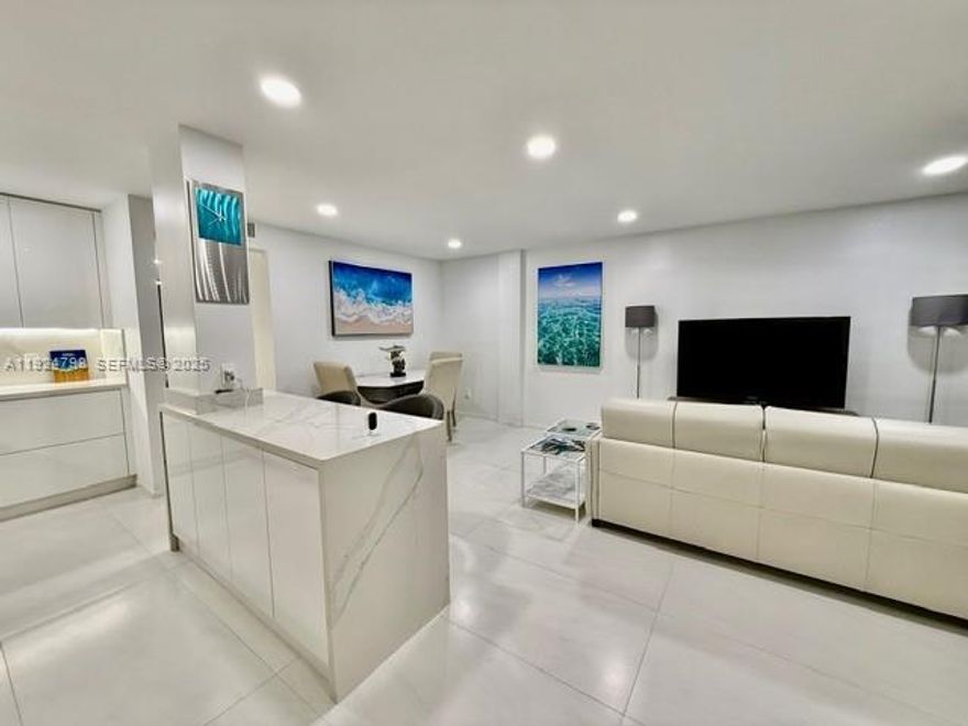 Modern luxury in the heart of South Beach, just one block from Biscayne Bay, steps from Whole Foods, minutes to Lincoln Road, and directly across from the Needham Field at Flamingo Park. This fully renovated residence delivers style, comfort, and coastal sophistication within a secure boutique building featuring a lobby elevator, swimming pool, and sun deck.
Freshly painted with impact windows, recessed lighting, and large-format porcelain flooring throughout. The Italian-inspired chef’s kitchen includes quartz countertops, modern cabinetry with under-cabinet lighting, and stainless steel Samsung appliances: double-door refrigerator, double oven, microwave, and dishwasher. High-end finishes and self-closing cabinetry elevate the space.
Additional highlights include a laundry room with stackable washer and dryer and a spa-style bathroom with Italian cabinetry, quartz counters, LED lighting, and a rainfall shower.
The spacious master suite features a private balcony, custom walk-in closets with built-ins, and upgraded ceiling fans. Move-in-ready and beautifully furnished, this residence blends modern elegance with South Beach vibrance, all within walking distance to Miami Beach’s best amenities. One parking spot included. Offered as an annual rental only and fully furnished.