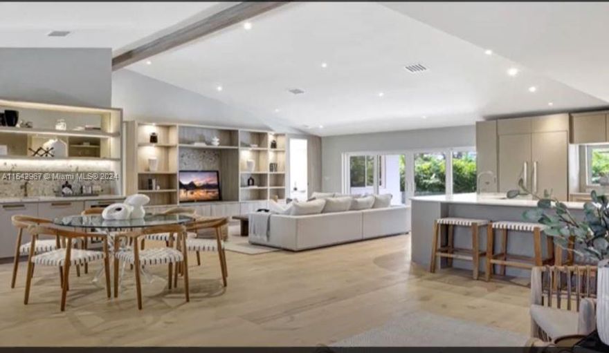 Discover the epitome of Miami luxury in the Upper East Side neighborhood, with this elevated gem, directly across from shimmering Biscayne Bay. Surrounded by the serene sway of palm trees, this residence is a haven of sophistication. Inside, find grandeur in 2 large social areas with panoramic bay views. This exquisite home features a split bedroom layout, ideal for families and entertaining. At its heart, a gourmet kitchen awaits the culinary enthusiast, equipped with a high-efficiency oven and warmer, where culinary dreams flourish. Al fresco dining and entertainment blend effortlessly into poolside relaxation. This property also boasts a highly coveted 2car garage, a rare find in the area. Embrace the Miami lifestyle, where luxury meets tranquility, in this ready-to-move-in sanctuary.