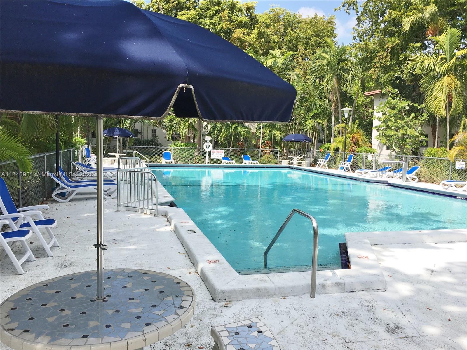 Available for occupancy 28, 2025. Lovely 2 bedroom / 1 bath condo located in lush private community, and close to it all. Unit is on the first floor, with backdoor leading directly out to the private community gardens. Kitchen with dishwasher. Amenities include a large community pool, several BBQ's and picnic tables. Walk to nearby restaurants, a short drive to UM, Shops at Sunset Place, Wholefoods, and Publix. Within the Sunset Elementary School zone. Hardwood floors throughout.
