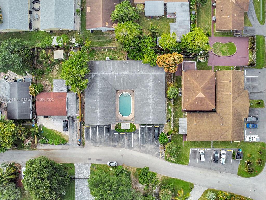 This well-maintained, turn-key 4-plex offers a fantastic investment opportunity in a prime location. The property features impact windows and doors, along with a newer 2016 roof. Residents can enjoy the community swimming pool. The four spacious units are all designed for comfort and convenience. Two units are 3-bedroom, 2-bathroom, and the other two units are 3-bedroom, 3-bathroom. Each unit is approximately 1,300 -1,400 square feet and includes a small backyard area. Every unit has two assigned parking spaces, and there are also two additional guest parking spots available. Located just minutes from I-95 and downtown Fort Lauderdale, this property offers easy access to major roadways. The beach and airport are just minutes away, making it a highly desirable location for tenants.