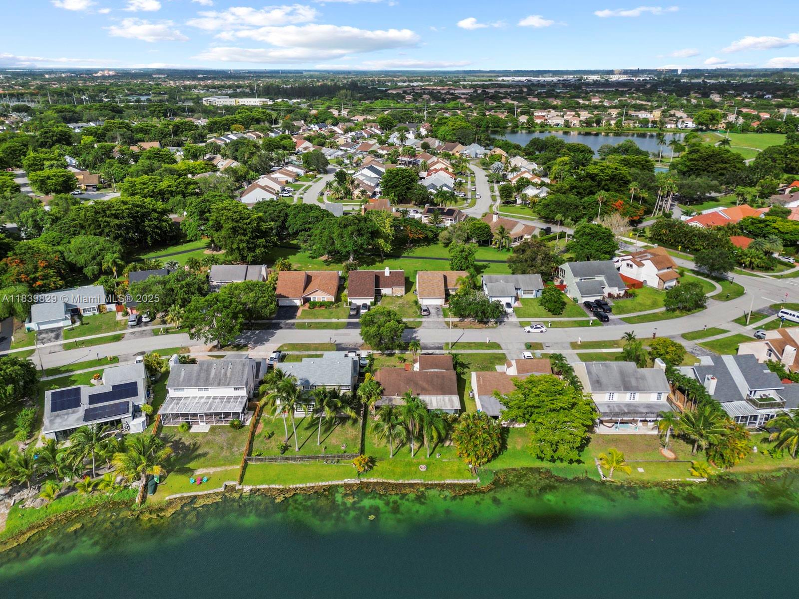 Lakefront 2/2 single-family home with an enclosed Florida room and a two-car garage located in the Villages of Homestead with low quarterly HOA fees. The community boasts a beautiful clubhouse with a pool, walking paths and many other amenities. This property is easy to show and is perfect for those looking for a comfortable and convenient living space. No HOA approval needed for move in. Seller will give a credit for new carpet at closing.