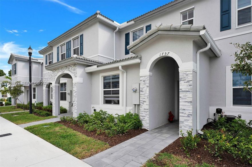 Beautiful 3-bedroom, 3-bath townhome located in the desirable Riviera community in Homestead. Built in 2022, this modern residence features an open-concept layout with a spacious living and dining area, and a contemporary kitchen with stainless steel appliances. One bedroom and a full bathroom are conveniently located on the first floor, ideal for guests or multi-generational living. The second floor features vinyl flooring throughout, offering both durability and a clean, modern look. Enjoy a private backyard space perfect for relaxing or entertaining. Community amenities include clubhouse, pool, and playground. Conveniently located near major highways, shopping, and schools.