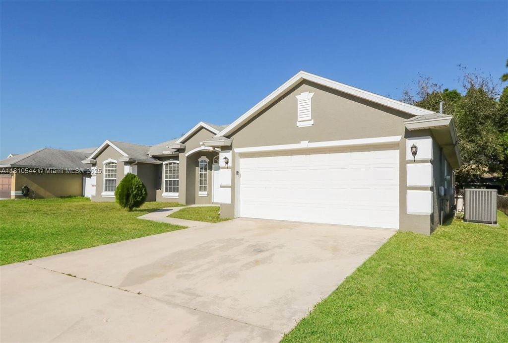 Photo of 1916 SW Glenco St, Port Saint Lucie, FL 34953 (MLS # A11810544)