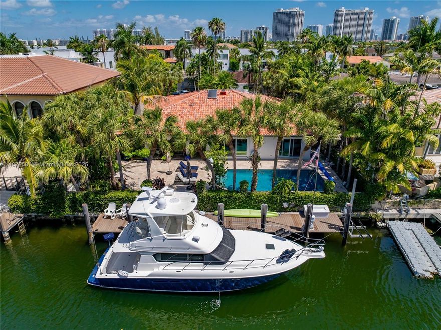 Completely renovated in 2025, this 4bed/3bath home has a sleek Mid-Century Modern aesthetic, blending timeless design with today’s luxury finishes. Situated on a 9,200 SF lot with 80 feet of waterfront, this property is a true boater’s dream – enjoy direct ocean access in just 15 minutes with no fixed bridges. Just minutes to Sunny Isles, Bal Harbour & Aventura, some of the home features include hurricane impact windows, heated saltwater pool w/ LED lighting, waterfalls & misting system, travertine deck, newer dock w/ lift, full smart-home AV system w/ indoor & outdoor speakers, european doors, custom closets, luxury baths w/ smart mirrors, gourmet kitchen w/ top appliances.