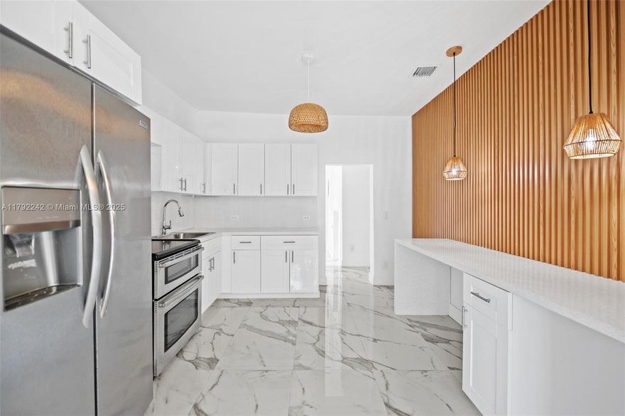 At this price the home won't last, priced below market for quick close! Step into a beautifully renovated 3-bed, 2-bath home where comfort, style, and opportunity meet. Enjoy a modern kitchen, updated bathrooms, new flooring, and a detached garage with private alley access—perfect for guests or future rental income. Nestled in vibrant North Miami Beach, you’re minutes from the beach, Aventura Mall, top shopping, parks, and dining. This home isn’t just move-in ready—it’s your chance to live closer to what matters, with a home designed for your lifestyle and future growth. Huge price improvement! Don't miss the opportunity to own a great home in a great area!