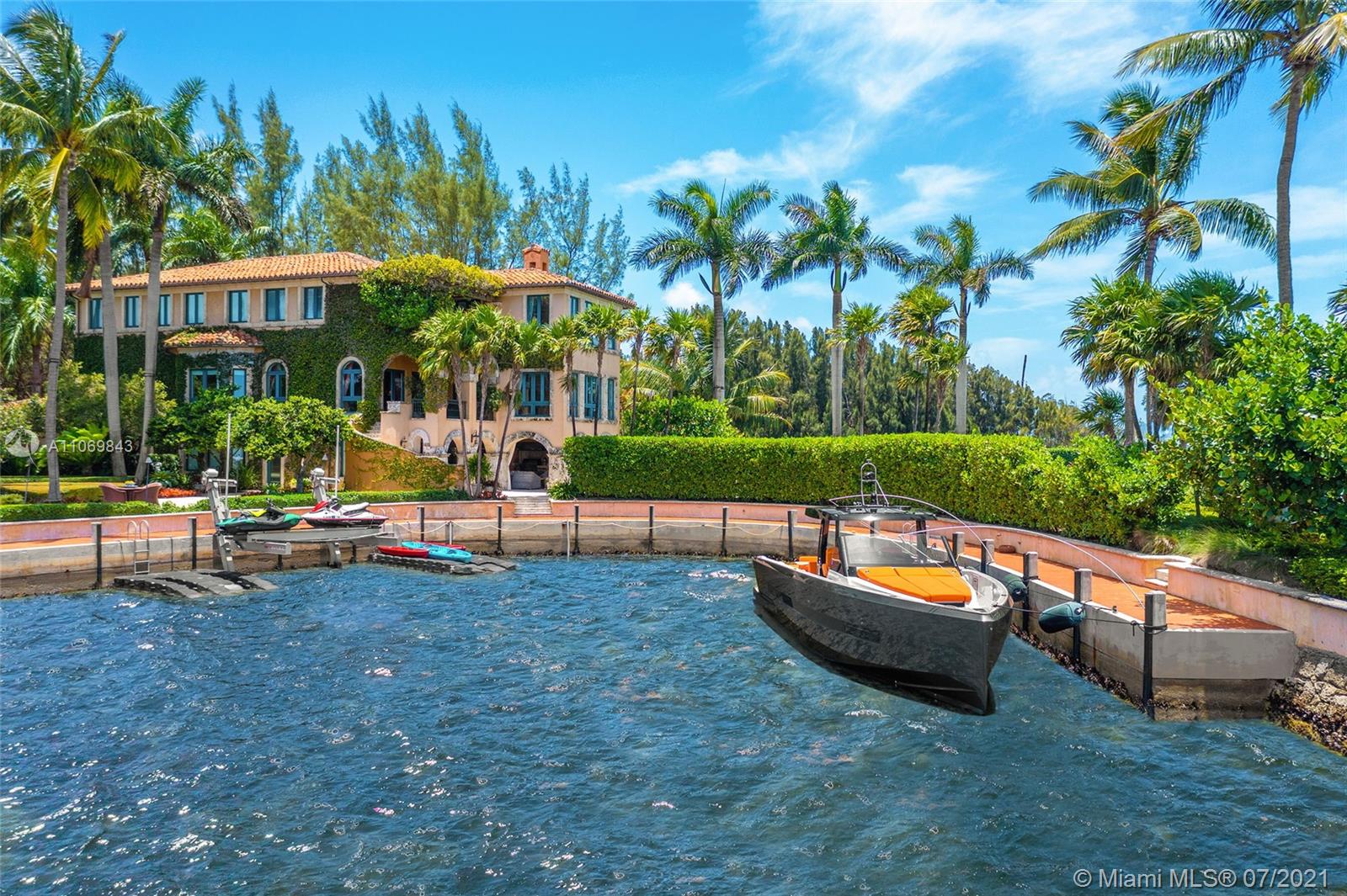 Welcome to Villa Cristina, world class waterfront estate delivers utmost privacy w/ approx. 1 acre of surrounding beauty & 482’ of WF that both awes & inspires. Enter through a private, cul de sac gated entrance framed by arching trees concealing a private sculpture garden & grounds that will take your breath away. Tucked within the prestigious guard-gated enclave of Hughes Cove, this compound exudes seclusion, sophistication & elegance. Encompassing 3 stories, the estate features views from every room, elevator, formal dining room, service quarters, gym, gourmet kitchen & office. Outdoors an infinity pool neighbors a magical pathway leading to a spa, private lounge overlooking the endless ocean vistas & a private cove w/ a dock. This Venetian style palazzo estate is in a class of its own.