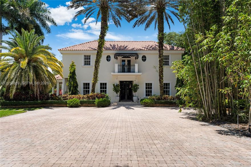 A residence that unfolds with intention. Set on a lush acre in Pinecrest, this reimagined estate is not just seen, it’s experienced. From the moment you enter, the home reveals a striking interplay of scale and texture: expansive marble-clad living spaces designed for impact, softened by the warmth of wood floors reserved exclusively for the private bedroom quarters. The contrast is deliberate, creating a refined transition from grand entertaining to intimate retreat.
At the heart of the home, a thoughtfully designed culinary core anchors the space. A discreet butler’s pantry seamlessly connects the kitchen and formal dining, allowing for effortless hosting while keeping preparation tucked away.

An expansive terrace extends from the main living areas through the family room and bedrooms, blurring the line between interior and exterior living and creating a continuous indoor-outdoor experience.
The layout adapts to modern living with a guest suite on the main level, while upstairs the primary retreat offers a private sanctuary with sitting area and spa-like bath. Outdoors, the pool setting is framed by mature greenery and open sky, offering both privacy and space to gather.
A rare offering for those who value design, flow, and presence.