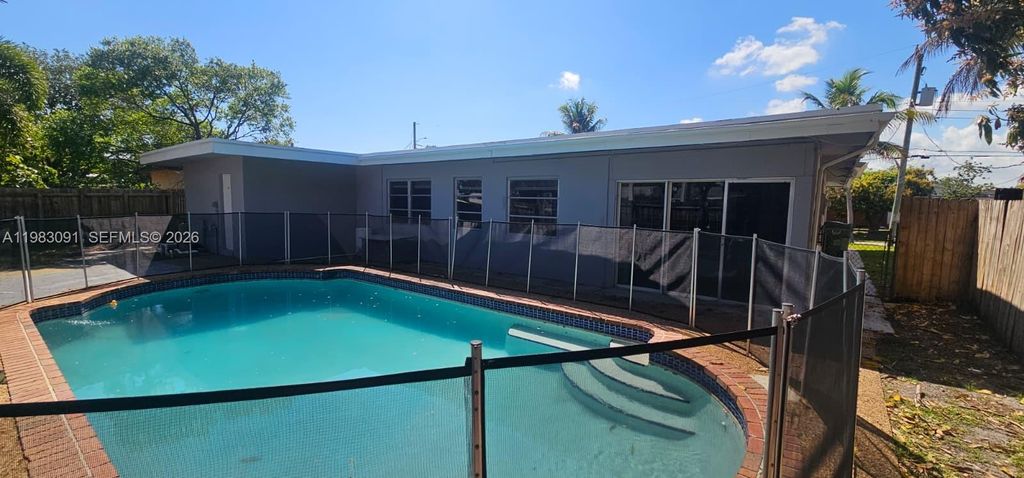 Photo of 1641 NW 45th St, Oakland Park, FL 33309 (MLS # A11983091)