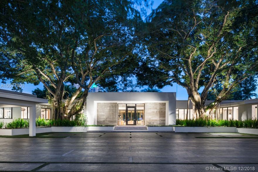 Distinctive architecture inspired by mid-century design, this estate style property blends contemporary interiors with a modern exterior. Flooded with natural light and surrounded by lush tropical gardens, this stunning residence boasts an open floor plan, expansive lot, lavish finishes, a gourmet kitchen with Calcutta gold marble countertops and a separate wing for guests/kids. Take in the colorful sunsets through sliding pocket glass doors overlooking the pool and dock. The Lakeview area is located between 48th Street and 51st terrace and is one of the most sought after neighborhoods in all of Mid Beach!