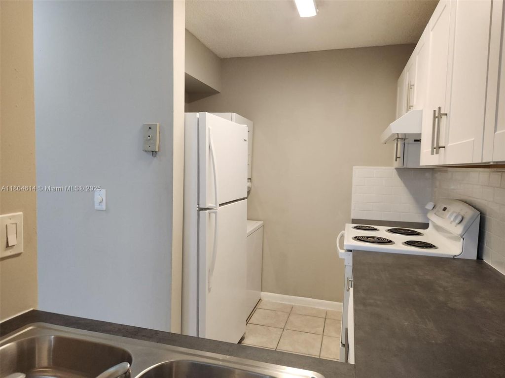 Photo of 3776 N University Dr #L-8, Coral Springs, FL 33065 (MLS # A11804614)