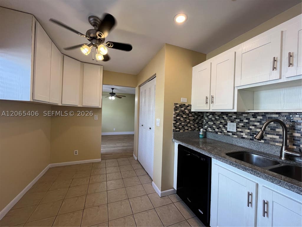 Photo of 5170 Tennis Ln, Delray Beach, FL 33484 (MLS # A12065406)
