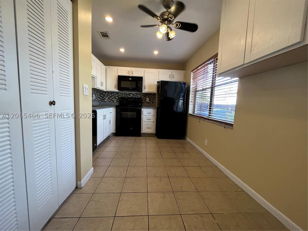 Photo of 5170 Tennis Ln, Delray Beach, FL 33484 (MLS # A12065406)
