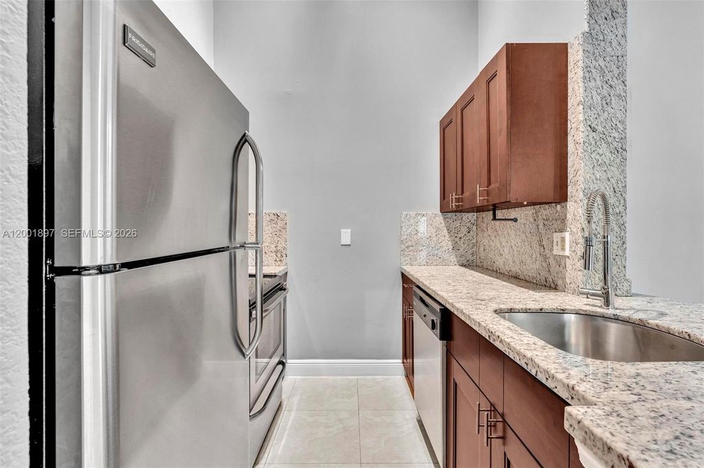 Photo of 2851 N Oakland Forest Dr #306, Oakland Park, FL 33309 (MLS # A12001897)