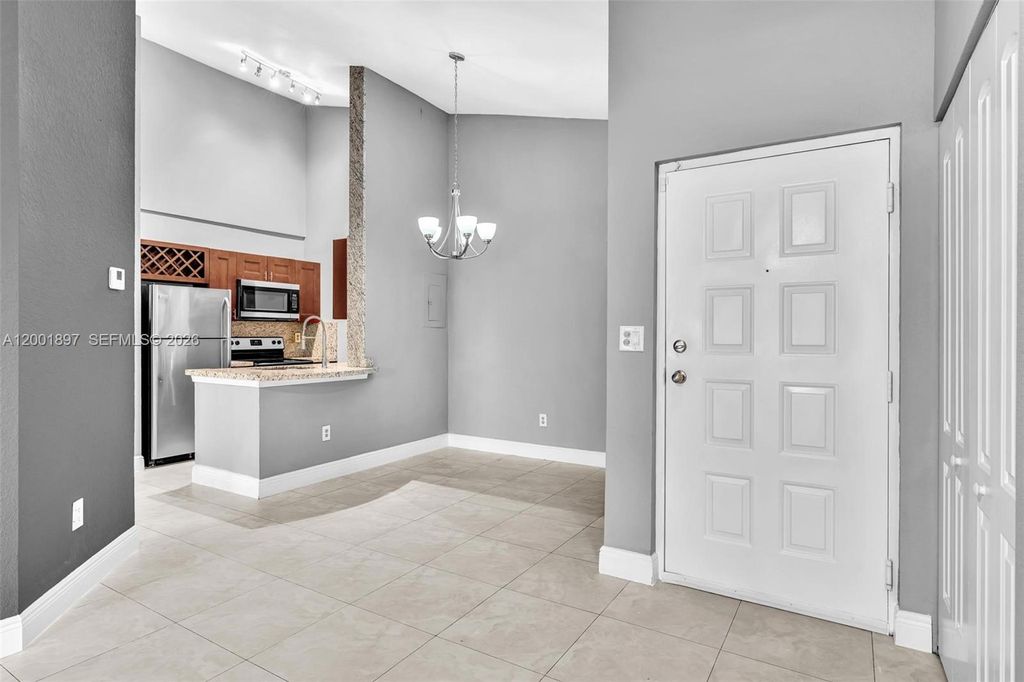 Photo of 2851 N Oakland Forest Dr #306, Oakland Park, FL 33309 (MLS # A12001897)