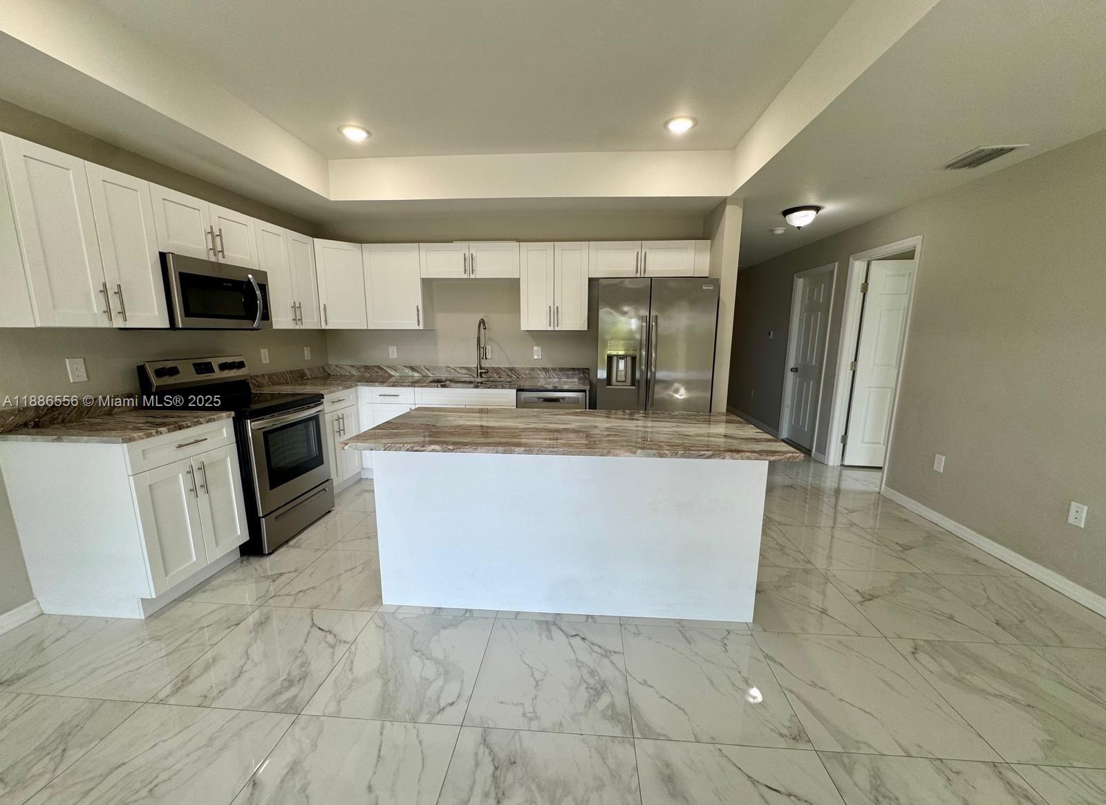 Welcome to this stunning 3-bedroom, 2-bathroom duplex, offering 1,150 sq. ft of modern living space designed for comfort and style. Step inside to an open-concept layout featuring gleaming marble-inspired tile floors that flow seamlessly from the spacious living area to the gourmet kitchen. The kitchen boasts white shaker cabinets, elegant quartz countertops with a beautiful veining pattern, stainless steel appliances including a range, microwave, dishwasher, and refrigerator, plus a convenient island perfect for casual dining or entertaining. Practical amenities include an in-unit washer and dryer, as well as an attached garage for secure parking and storage.
This move-in-ready duplex combines functionality with upscale touches—schedule your showing today!