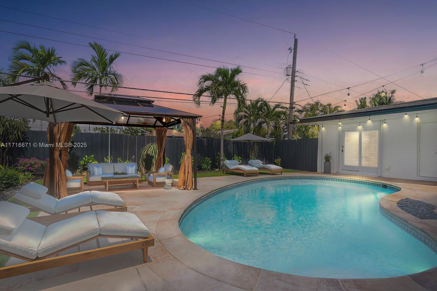 SELLER MOTIVATED!! Instant equity at closing — Appraised at $1.2M! Spacious 5-bedroom, 3-bathroom home with beautiful backyard. The kitchen boasts granite countertops and stainless steel appliances. The master suite has a walk-in closet and en-suite bath with a soaking tub and shower. Enjoy the fenced backyard with a patio & gazebo. Smart locking systems and security cameras add convenience and security. Located near shopping, dining, and entertainment, this home offers comfort and convenience. Don't miss out on this fantastic opportunity to own a Fort Lauderdale gem! Salt pool.