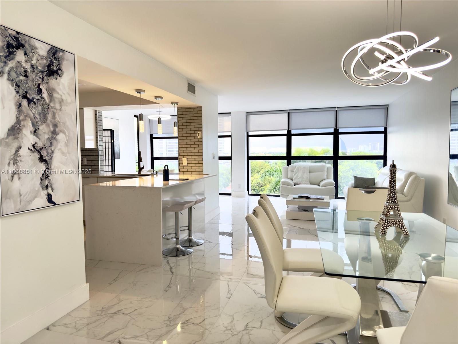 Fully furnished and move-in ready! Step into elegance in this beautifully renovated, spacious 1 bedroom. Floor-to-ceiling glass offers gorgeous sunset views. Polished marble floors, quartz countertops, and sleek finishes set a refined tone, while custom Italian furnishings, an adjustable king bed, remote-control blinds, and top-of-the-line LG smart appliances create a seamless blend of comfort and innovation.
The building offers resort-style amenities including a waterfront pool, tennis courts, a modern fitness center, clubhouse, library, and game room. Just moments from pristine beaches, fine dining, boutique shopping, and world-class entertainment, this residence offers a lifestyle as effortless as it is luxurious.
Sophisticated intracoastal living at its most refined!