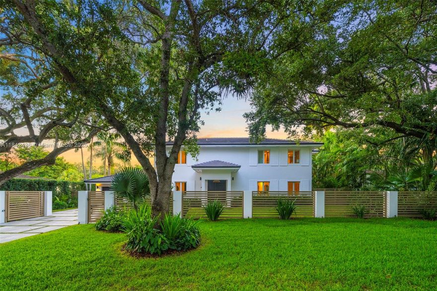 Chic, contemporary, recently renovated residence in the heart of Coral Gables. This home is nestled on a spacious, fenced & gated 11,000 SF oversized lot, adorned with towering oak trees and lush landscaping. Boasting sun-drenched interiors, high ceilings, & an open custom Snaidero kitchen with coffee bar, wine cooler, & Miele and Wolf appliances. Great layout with 3 bedrooms upstairs and 1 downstairs, all with ensuite bathrooms. Perfect for entertaining, enjoy an ultra-private backyard with resort-style pool, jacuzzi, cabana bathroom, & covered gazebo with summer kitchen for Al Fresco dining. Plenty of parking & 2-car garage with projector and golf simulator. Close to top public & private schools: Sunset Elementary, Gulliver, St. Thomas Episcopal, & Ransom Everglades. NOT IN FLOOD ZONE!
