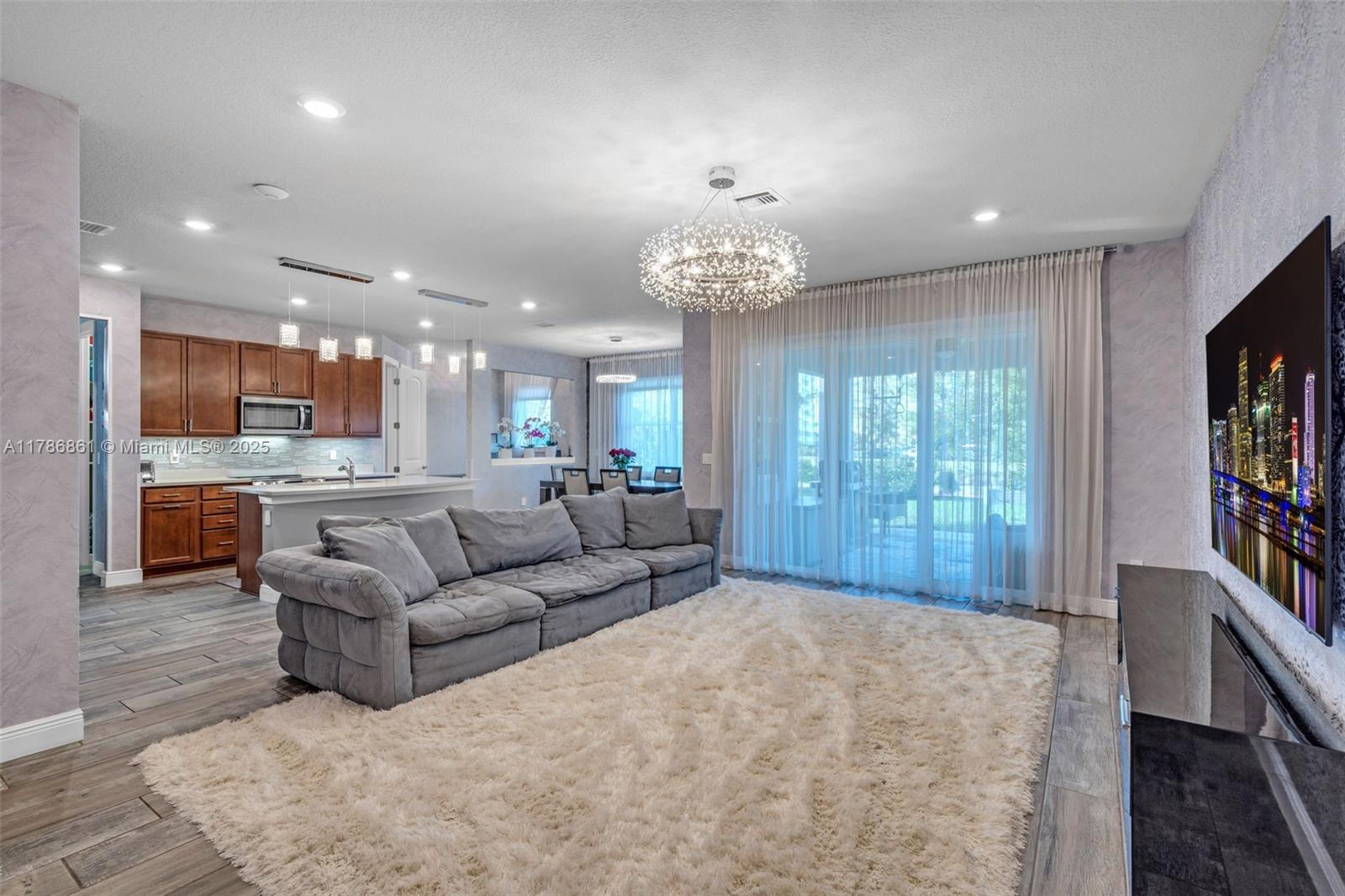 Fully furnished ready to move in! 2,679 sqft 5 bedroom, 2.5 bathroom single family house in prestigious gated Parkview at Hillcrest community, on a large corner lot ideal for entertainment. Extended 2-car garage with AC, additional parking in driveway, extended covered lanai, huge backyard with lake views and BBQ, open kitchen with expansive island, two refrigerators, induction oven, and more. Upstairs are 4 bedrooms, modern loft, laundry room. Smart home, large smart TVs, electronic door lock, automatic garage gate. Parkview at Hillcrest offers high-class amenities, Olympic-sized heated pool, BBQs, kids playground, fitness center, tennis courts, scenic jogging/walking trails in 70-acre park. Minutes to Aventura, Brightline, Ft. Lauderdale downtown & airport, Hollywood beach. Easy to show!