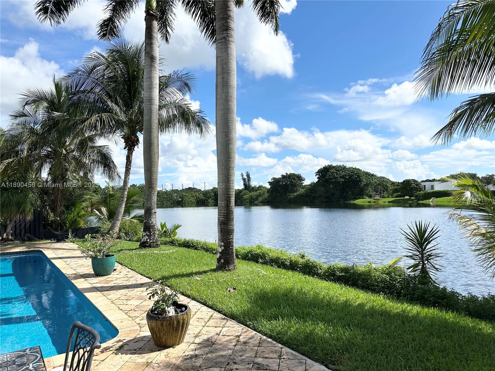 WELCOME TO YOUR TROPICAL OASIS!! THIS 4 BEDROOM 3 BATH HOME LOCATED IN HIGHLY SOUGHT AFTER JACARANDA COMMUNITY. PERFECTLY DESIGNED FOR RELAXATION AND ENTERTAINING WITH A 400 SQ. FOOT RAISED OUTDOOR KITCHEN/LIVING AREA (FULLY PERMITTED AND INSPECTED) AMAZING VIEWS OVER LOOKING THE LAKE WITH AN OVERSIZED NEWLY RESURFACED SPARKLING CRYSTAL BLUE POOL. THIS HOME SITS ON AN OVERSIZED LOT OF MORE THAN 13,000 SQUARE FEET. ENJOY YOUR OWN DELICIOUS MANGO TREE WHILE SITTING BY THE POOL. MAJOR UPDATES- IMPACT DOORS, AC UNIT, WATER HEATER, WASHER & DRYER, ZEBRA BLINDS. WONDERFUL NEIGHBORHOOD ON QUIET STREET THAT ENDS IN A CUL-DE-SAC. BEST OF ALL LOCATION CLOSE TO SHOPPING, DINING, MAJOR HIGHWAYS. MOVE IN DATE IS POSSIBLY FLEXIBLE.