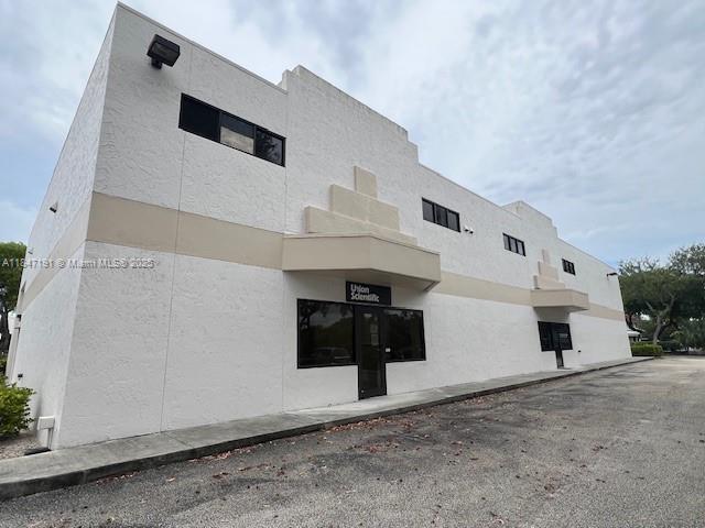 Rarely Available Lakefront Office/Warehouse Space at Lake Vista! This impeccably maintained 2,297 SF unit offers a flexible layout with 2 private offices, 2 restrooms, and soaring 28-foot ceilings, ideal for creative professionals, architects, designers, or light manufacturing. Fully air-conditioned with two split AC systems, this space delivers comfort and efficiency. Enjoy serene lake views in a quiet, professional park-like setting is perfect for focus and productivity. Zoned for flexibility and functionality, this unit can accommodate both pure office or office/warehouse use. Includes generous parking at 2 spaces per 1,000 SF. One roll-up door in move-in ready condition.