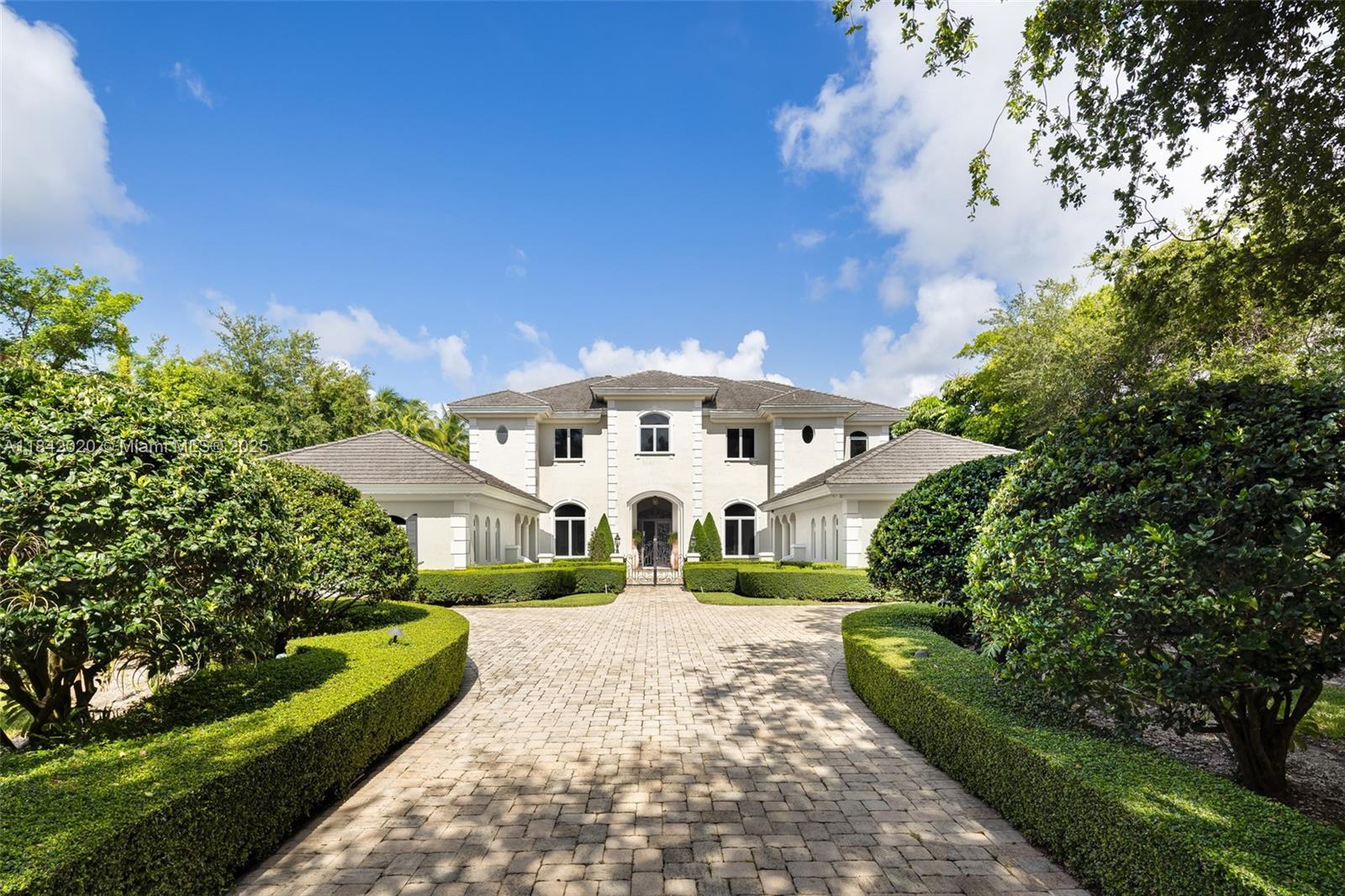 Nestled in the exclusive Ponce-Davis neighborhood, this timeless French-inspired estate offers a blend of classic elegance and refined comfort. Set on over 51,000 square feet of lush, gated grounds, the home was crafted by Palmira Homes and features expansive living spaces designed for gracious living and effortless entertaining. A stately foyer opens to a formal salon, library, media room, and a gourmet kitchen with full catering pantry. Outdoors, a summer kitchen, and a resort-style pool create a tranquil escape surrounded by manicured gardens. A four-car garage and elevator complete this exceptional offering. Located on one of Miami’s most coveted streets, just minutes from top schools and the best of Coral Gables. A true legacy property in one of the city's most prestigious enclaves.