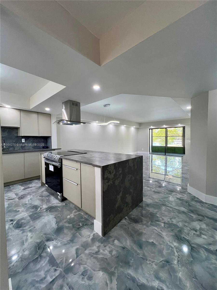 PERFECTION DOES EXIST! COME SEE THIS STUNNING HOME IN THE HEART OF TAMARAC. RETIRE IN TOP OF THE LINE STYLE. CUSTOM QUARTZ COUNTER TOPS WITH AN OPEN FLOOR PLAN AND COOKING ISLAND AWAIT ALL OF YOUR FABULOUS MEALS AND GATHERINGS. STAINLESS STEEL APPLIANCES HAVE A 2 YEAR WARRANTY. CUSTOM GORGEOUS TILE THROUGHOUT THIS FRSHLY REMODELED HOME WITH FROSTED GLASS DOORS AS YOU WALK INTO EVERY AMAZINGLY LIT ROOM. THERE IS A SPACIOUS DEDICATED LAUNDRY ROOM WITH PLENTY OF STORAGE. LETS NOT FORGET THE SPA BATHROOMS WITH MODERN TOUCHES SUCH AS COLORFUL FUN WATER TEMPERATURE INDICATION! IT ALSO HAS BEAUTIFUL LAKE VIEWS. EVERYTHING IN THIS HOME IS SMART (LIKE IT'S FUTURE OWNER) FROM THE KITCHEN APPLIANCES TO THE CAMERA AND LOCKS ON THE DOOR! THERE ARE SOME AWESOME AMENITIES AS WELL! CALL FOR AN APPOINTMENT