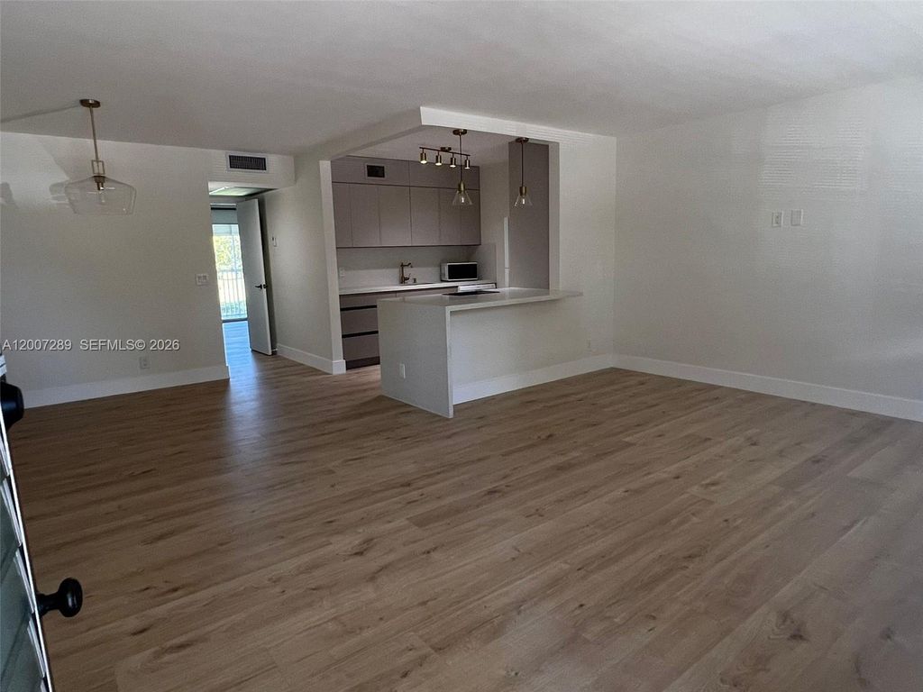 Photo of 13155 SW 7th Ct #204E, Pembroke Pines, FL 33027 (MLS # A12007289)