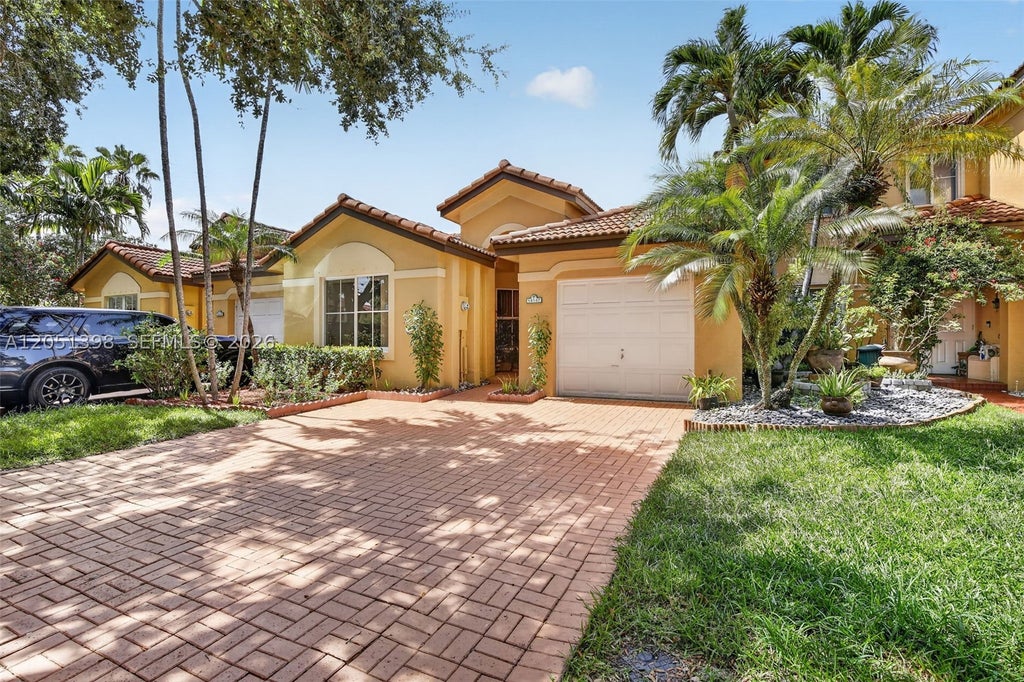 Photo of 14147 N Forest Oak Cir, Davie, FL 33325 (MLS # A12051398)